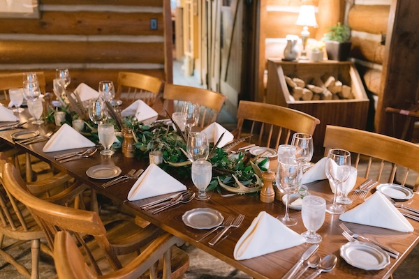 Rustic wooden table and decor for a private family dinner defore a Wisconsin Destination wedding.