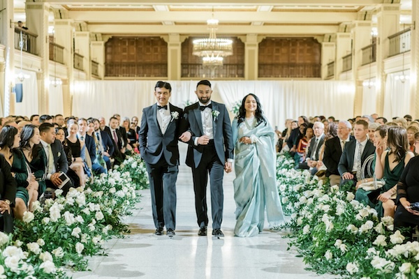 Indianapolis groom walking down the aisle with his parents.