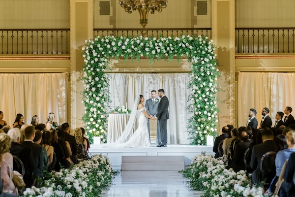 Bride and groom exchanging wedding vows at their luxurious Indianapolis wedding ceremony.