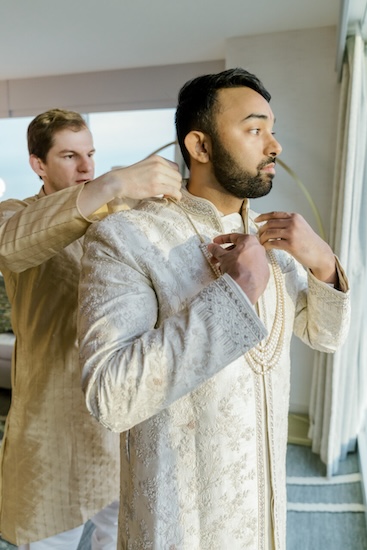 Indianapolis groom dressing for the first of two wedding ceremonies.