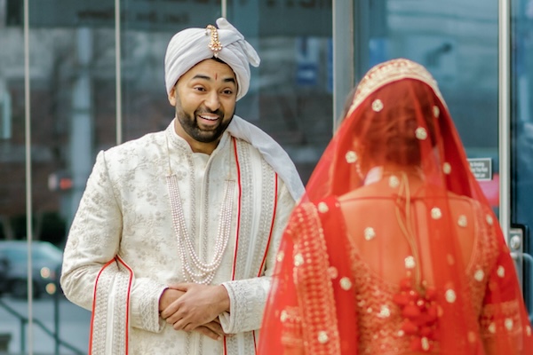 Bride and groom's first lookmbeofre thier Indianapolis Hindu wedding ceremony.