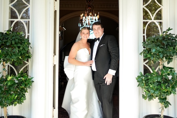 Bride and groom on the steps of the Governor Thomas Bennett House in Charleston South Carolina