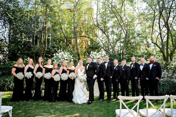 Bride and groom with thier wedding party at the Governor Thomas Bennett House beofre thier Charleston Destination wedding.