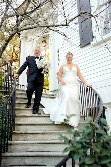 Bride and her father walking down the satirs of the Governor Thomas Bennett House