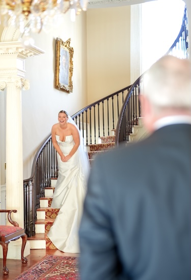 Bride and dad seeing each other for the first time ion her wedding day