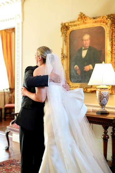 Bride hugging her father after their first look