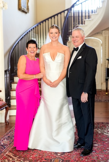 Bride with her parents beofre her Charleston destination wedding