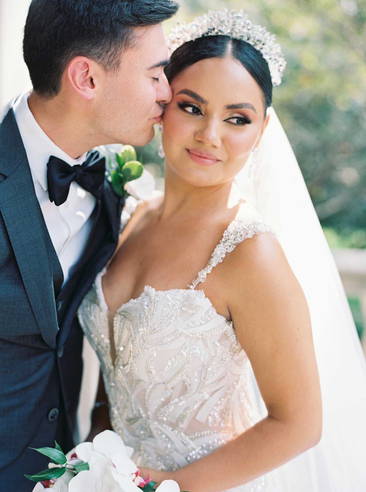 groom kissing his bride sweetly