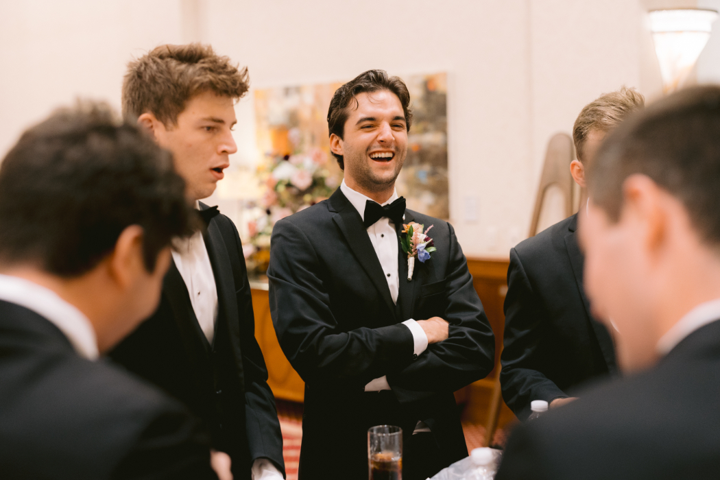 A groom, surrounded by his groomsmen.