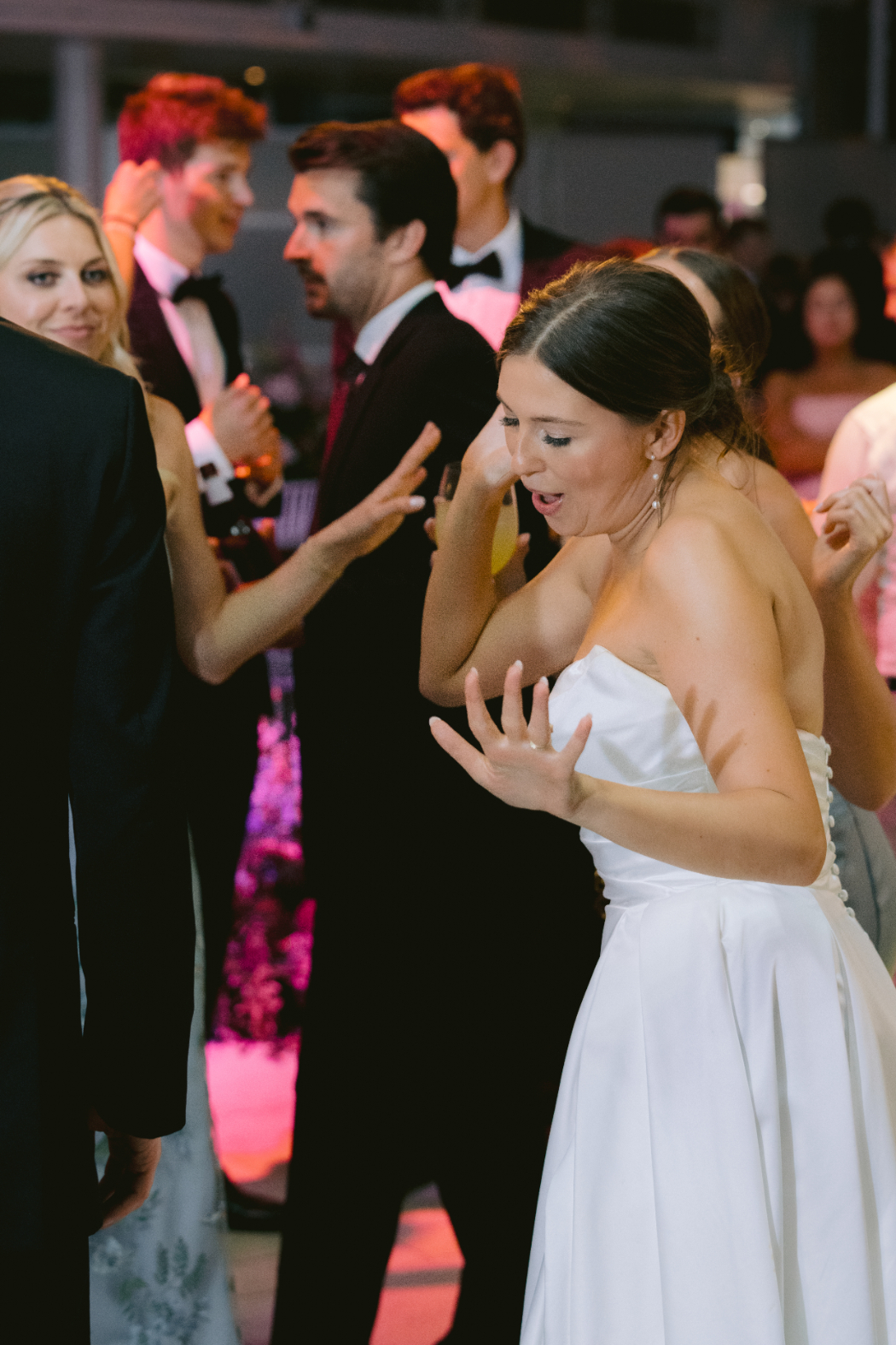 bride dancing with guests at wedding reception at arts garden 