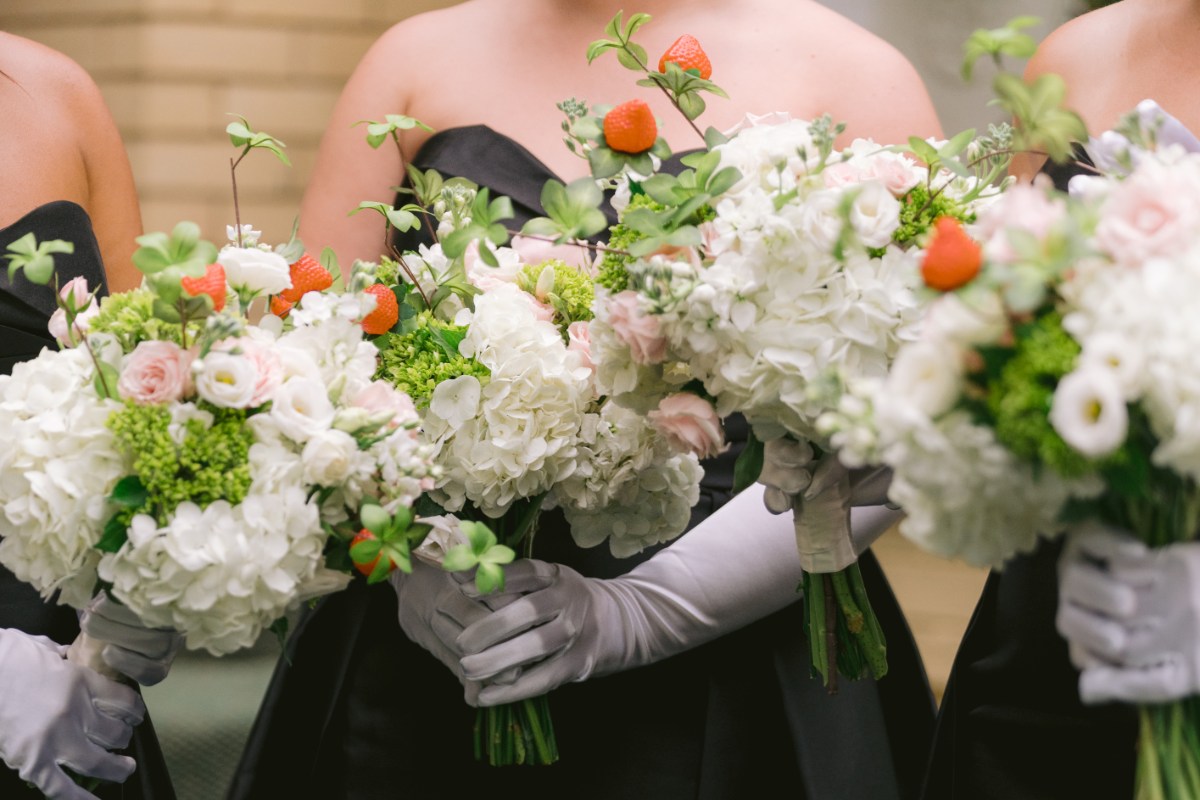 bridesmaids lined up holding flowers at wedding West Baden Springs Resort